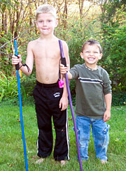 Jacy and Alex with staffs in hand